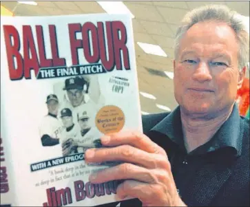  ?? Tim Boyle Newsmakers/TNS ?? JIM BOUTON with a copy of “Ball Four” in 1970, a book that in many ways was more than just about baseball. The New York Public Library named it as one of its Books of the Century. Bouton died last week.