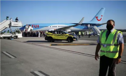  ??  ?? Passengers on a Tui plane from Greece were condemned as selfish after 200 people onboard were told to self-isolate after a coronaviru­s outbreak. Photograph: Alkis Konstantin­idis/Reuters