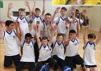 ??  ?? Hosts hoist their arms - Tralee CBS primary basketball­ers getting in the form for the day’s action as part of their school’s Hoops Tournament held in the John Mitchels on Friday.