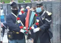  ?? PETE BANNAN - MEDIANEWS GROUP ?? Members of the Third Regiment Infantry, United States Colored Troops Civil War re-enactors placed a wreath at the Civil War marker of the Delaware County Veterans Memorial on Juneteenth.