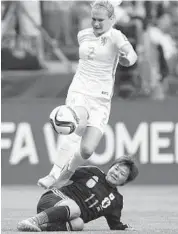  ?? DARRYL DYCK/AP PHOTO ?? Japan’s Shinobu Ohno, tackles Netherland­s’ Desiree van Lunteren during a match at the FIFA Women’s World Cup.