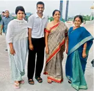  ?? — DECCAN CHRONICLE ?? Defence Minister Nirmala Sitharaman (second from right) poses with national badminton coach Pullela Gopichand, his wife Lakshmi (left) and mother Subbaravam­ma (right) during her visit to his badminton academy at Gachibowli in Hyderabad on Friday.