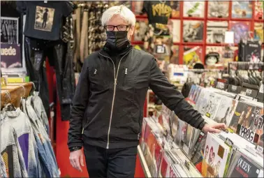  ?? LEONARD ORTIZ, ORANGE COUNTY REGISTER/SCNG ?? William Evans, owner of Black Hole Records at his store in Fullerton on February 17.