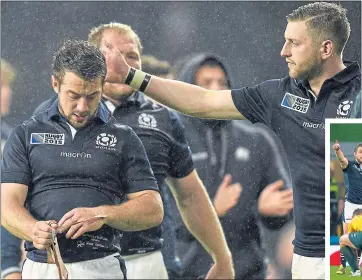  ??  ?? Finn Russell consoles Greig Laidlaw following his confrontat­ion with ref Craig Joubert in the quarter-final loss to Australia at Twickeham four years ago