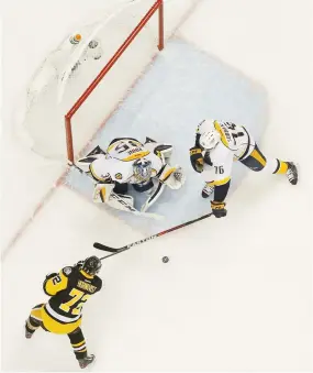  ??  ?? Pekka Rinne #35 and P.K. Subban #76 of the Nashville Predators defend against Patric Hornqvist #72 of the Pittsburgh Penguins in Game Two of the 2017 NHL Stanley Cup Final in Pittsburgh, Pennsylvan­ia on Wednesday. (AFP)