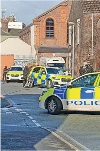  ?? ?? ● Armed police otuside an address on Lacey Steet in Widnes on Sunday