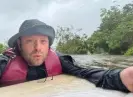  ?? ?? Johnny Lauder wades through flood waters in Naples, Florida. Photograph: Via the Lauders’ GoFundMe campaign