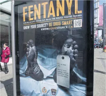  ?? THE CANADIAN PRESS/FILES ?? An anti-fentanyl advertisem­ent is seen in downtown Vancouver last year. New government figures show that nearly 4,000 Canadians died from apparent opioid overdoses last year, with men the most likely victims and fentanyl the clear culprit.