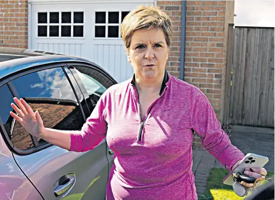  ?? ?? Nicola Sturgeon talks to reporters outside her Glasgow home yesterday