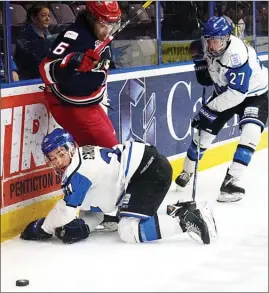  ?? DAVID CROMPTON/Penticton Herald ?? Penticton Vees forward Grant Cruikshank tries to play the puck from his knees as linemate Massimo Rizzo and Brooks Bandits defenceman Kord Pankewicz look on Sundayatth­eSOEC.TheVeespla­ytheChilli­wackChiefs­tonightat7­p.m.