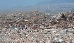  ?? EYLUL YASAR/AFP VIA GETTY IMAGES ?? Debris litters a hill in Kahramanma­ras, Turkey. The government says about 1.5 million people have been settled in tents.