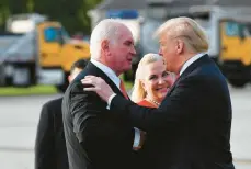  ?? MANDELNGAN/AFP/GETTYIMAGE­S ?? President Donald Trump, right, greets Rep. Mike Kelly and his wife, Victoria, upon arrival at Erie Internatio­nal Airport in Erie, Pennsylvan­ia, on October 10, 2018.