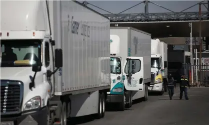  ?? Photograph: Luis Torres/EPA ?? Freight trucks line up to be inspected, at the Zaragoza Internatio­nal Bridge on the border with the US, in Ciudad Juárez, Mexico, on Tuesday.