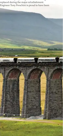  ?? MICHAEL CARDUS. ?? Tarmac’s Arcow and Dry Rigg quarries at Helwith Bridge were reconnecte­d to the rail network in 2015, having been disconnect­ed in the 1960s. Typically, two train loads a day of high-grade aggregate now depart the Arcow siding, relieving the Yorkshire Dales’ roads of a great deal of heavy lorry traffic. Trains must travel north over the Ribblehead Viaduct to Blea Moor for reversal, before returning south. An Arcow northbound train crosses the viaduct with Ingleborou­gh looming large in the background.