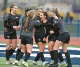  ?? STEVE JOHNSTON/DAILY SOUTHTOWN ?? Lincoln-Way Central’s Chloe Grundhofer, second from right, gets congratula­tions after scoring the first goal against Lincoln-Way East during the Windy City Ram Classic semifinals at Reavis in Burbank on Tuesday.