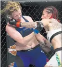  ?? Erik Verduzco ?? Las Vegas Review-journal
@Erik_verduzco Champion Cris “Cyborg ” Justino, right, delivers a left to the side of the head of Tonya Evinger in their women’s featherwei­ght title bout won by Justino at UFC 214 on July 29 at the Honda Center in Anaheim,...