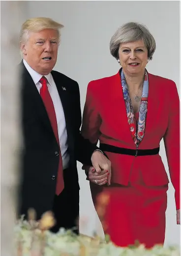  ?? CHRISTOPHE­R FURLONG / GETTY IMAGES ?? U. S. President Donald Trump and British Prime Minister Theresa May stroll The Colonnade at the White House in Washington, D.C., on Friday. May, on a two- day visit to the United States, is the first world leader to meet with Trump.