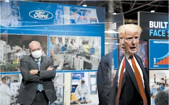  ?? ALEX BRANDON/AP ?? President Trump declines to wear a face mask Thursday as he tours a Ford plant in Michigan now making medical gear.