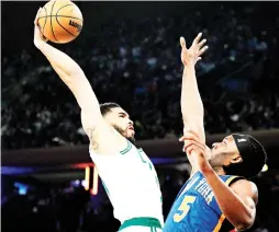  ?? AFP PHOTO ?? Jayson Tatum of the Boston Celtics attempts a dunk against Precious Achiuwa of the New York Knicks during the first half at Madison Square Garden on Saturday, Feb. 24, 2024, in New York City.