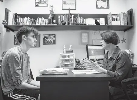  ?? Photos by Annie Mulligan / Contributo­r ?? Blake, a sophomore, works one-on-one with teacher Deborah Pifer at the Tenney School in west Houston. Students with different learning styles are able to find individual attention and unique learning plans that fit their needs, head of school Mike Tenney said.