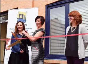  ?? NEWS PHOTO PEGGY REVELL ?? Acting mayor Celina Symmonds, interim executive director of McMan Youth Family and Community Services Associatio­n Leah Schmidt, and Tracy Noullett representi­ng the Chamber of Commerce cut the ribbon Tuesday at the official opening of Youthopia.