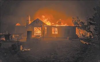  ?? KYLE GRILLOT/GETTY-AFP ?? A home is destroyed by the Bobcat fire Friday in Juniper Hills, Calif. The fire has burned tens of thousands of acres in the state and is threatenin­g some desert communitie­s.