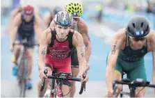  ?? GRAHAM HUGHES/THE CANADIAN PRESS ?? Tyler Mislawchuk of Canada has done well enough at events this year such as the ITU World Triathlon Series race in Montreal in August to be ranked eighth in the world.