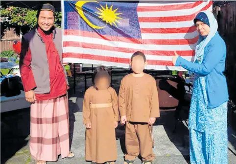  ?? Photo / Supplied ?? Rahimi Ahmad, his wife Azila and their two children at home in Christchur­ch. Rahimi entered one of two mosques attacked by gunmen yesterday, but never came out.