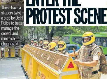  ?? PHOTO: SARANG GUPTA/HT ?? These new barricades will be slippery on the side facing protesters, making it almost impossible for them to climb on or balance themselves atop the barricades. The other side has support for cops to climb and handle the crowd