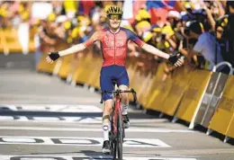  ?? DANIEL COLE AP ?? Spain’s Carlos Rodriguez crosses the finish line to win the 14th stage of the Tour de France over 94.5 miles, ending in Morzine Les Portes du Soleil, France.