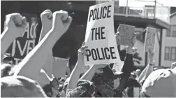  ?? GENE J. PUSKAR/AP ?? Protesters participat­e in a Black Lives Matter rally on Mount Washington overlookin­g downtown Pittsburgh on Sunday.