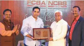  ??  ?? Govind Gaude, minister of Cooperatio­n, Arts & Cwwulture, Goa, presenting the lifetime achievemen­ts award to H.K. Patil