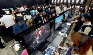  ?? AFP ?? A file photo of people trying new videogames at the Tokyo Game Show 2016 —