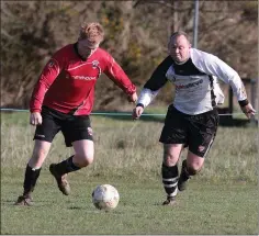  ??  ?? Martin Fitzharris of St. Leonards is tracked by Paddy Harnett.