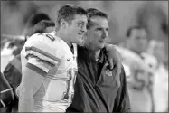  ?? AP-Stephen Morton, File ?? Tim Tebow (left) and Urban Meyer, then Florida’s HeismanTro­phy winning quarterbac­k and coach, respective­ly, stand together during a game in 2008.