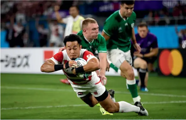  ?? AP ?? Kenki Fukuoka scores Japan’s vital try during their incredible Pool A victory over Ireland at Shizuoka Stadium Ecopa in Shizuoka yesterday.