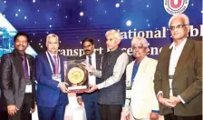  ?? ?? Vice-Chairman and MD of APSRTC Ch. Dwaraka Tirumala Rao receiving the award at a function held in New Delhi on Friday.