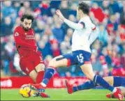  ?? GETTY ?? Liverpool’s Mohamed Salah on way to scoring the team’s third goal against Bournemout­h at Anfield on Saturday.