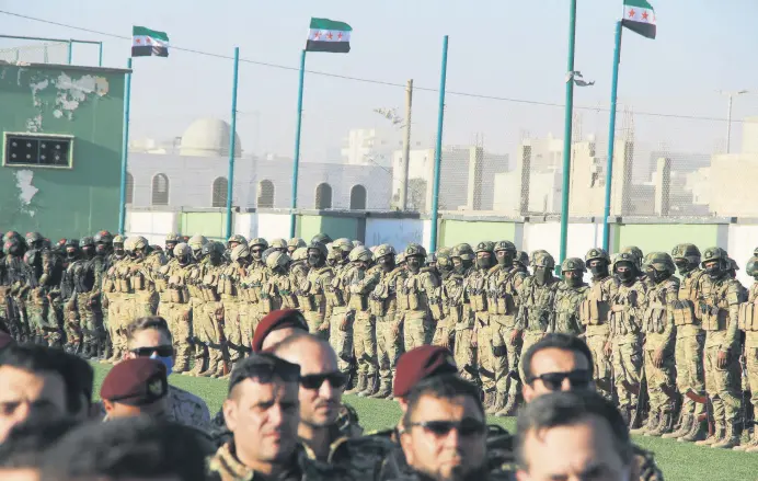  ?? ?? Five military groups operating under the Turkey-backed Syrian National Army (SNA) in northern Syria unite as the Syrian Liberation Front during a ceremony held in al-Bab, northern Syria, Sept. 9, 2021.