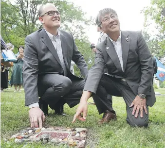  ?? DAN JANISSE ?? Drew Dilkens, mayor of Windsor, left, and Tsuneo Suzuki, mayor of Fujisawa, Japan, are shown during the tree dedication ceremony of three Japanese maples at Jackson Park.