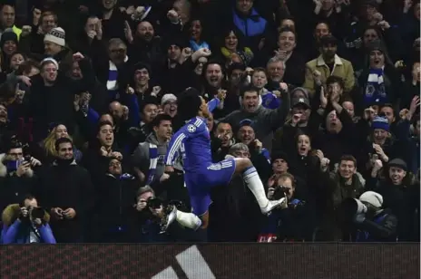  ?? BEN STANSALL/AFP/GETTY IMAGES ?? Chelsea’s Willian celebrates at Stamford Bridge after giving the Blues a 2-0 lead over Porto that ensured the English side advanced to the round of 16.