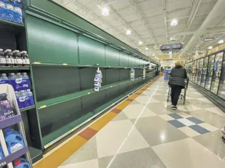  ?? BY LUKE CHRISTOPHE­R FOR FOOTHILLS FORUM ?? March 16: The paper aisle at Harris Teeter in Warrenton is bare as the pandemic disrupted supply lines. That same day, Rappahanno­ck’s public schools closed temporaril­y — and didn’t reopen again until August.