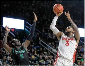  ?? DAVID JABLONSKI / STAFF ?? Trey Landers, one of the more beloved members of this historic Flyers team, is the only player born and raised in Dayton. Here he shoots against George Mason last month.