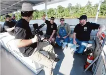  ?? Kim Brent/Staff photograph­er ?? Cast and crew of the Canadian TV series “Fishing for History,” by Farpoint Films, journey down the Neches River.