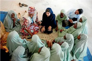  ?? PHOTO: REUTERS ?? Nobel Peace Prize winner and education activist Malala Yousafzai talks with students during her visit to Yerwa Girls School in the northeaste­rn Nigerian city of Maiduguri yesterday.