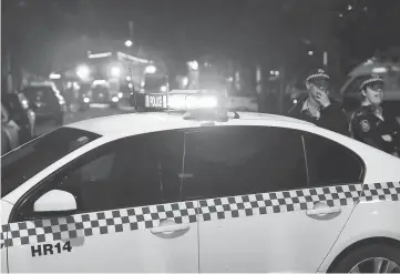  ??  ?? Police cordon off the area around a police station in the Merrylands neighbourh­ood area of Sydney. — AFP photo