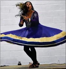  ?? ?? Vancouver’s Karima Essa, a three-time Canadian national dance champion, gave a dynamic performanc­e during her Bollywood Show at the Cultural Extravagan­za in Swift Current, Sept. 24.