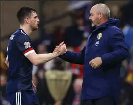  ?? ?? Andy Robertson was substitute­d off by manager Steve Clarke