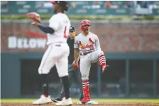  ?? BRETT DAVIS/USA TODAY ?? The Cards’ Kolten Wong reacts after driving in two runs in the first inning, when St. Louis cruised to a 10-0 lead en route to a 13-1 win over the Braves in Game 5 of their series Wednesday in Atlanta.