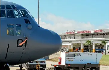  ?? NZ DEFENCE FORCE via AP ?? A New Zealand Defence Force Hercules aircraft arrives at Tonga’s Fua’amotu Internatio­nal Airport, near Nuku’alofa on Thursday to deliver aid.